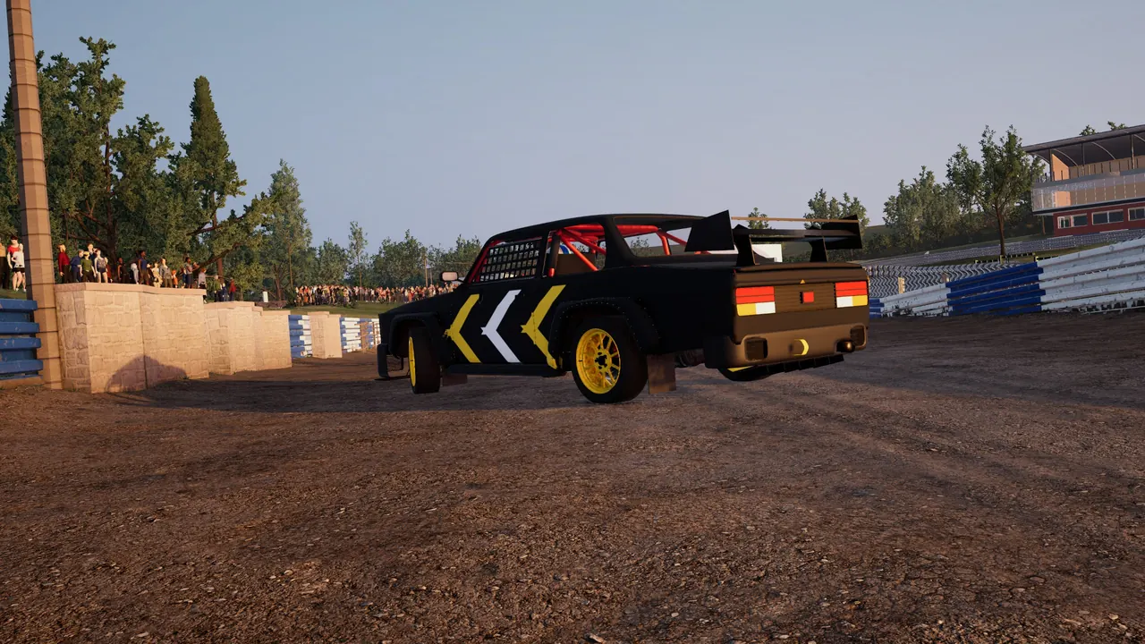 Rear-wheel-drive car sliding on dirt in front of the crowd